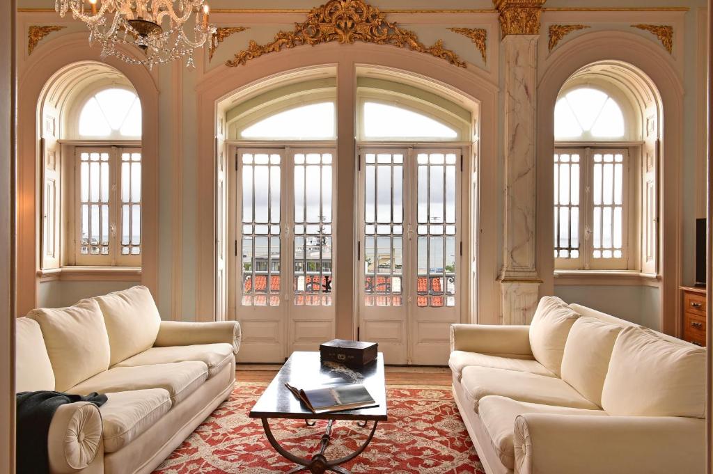 Interior hall with tiled walls, carved wood and a coloured glass window