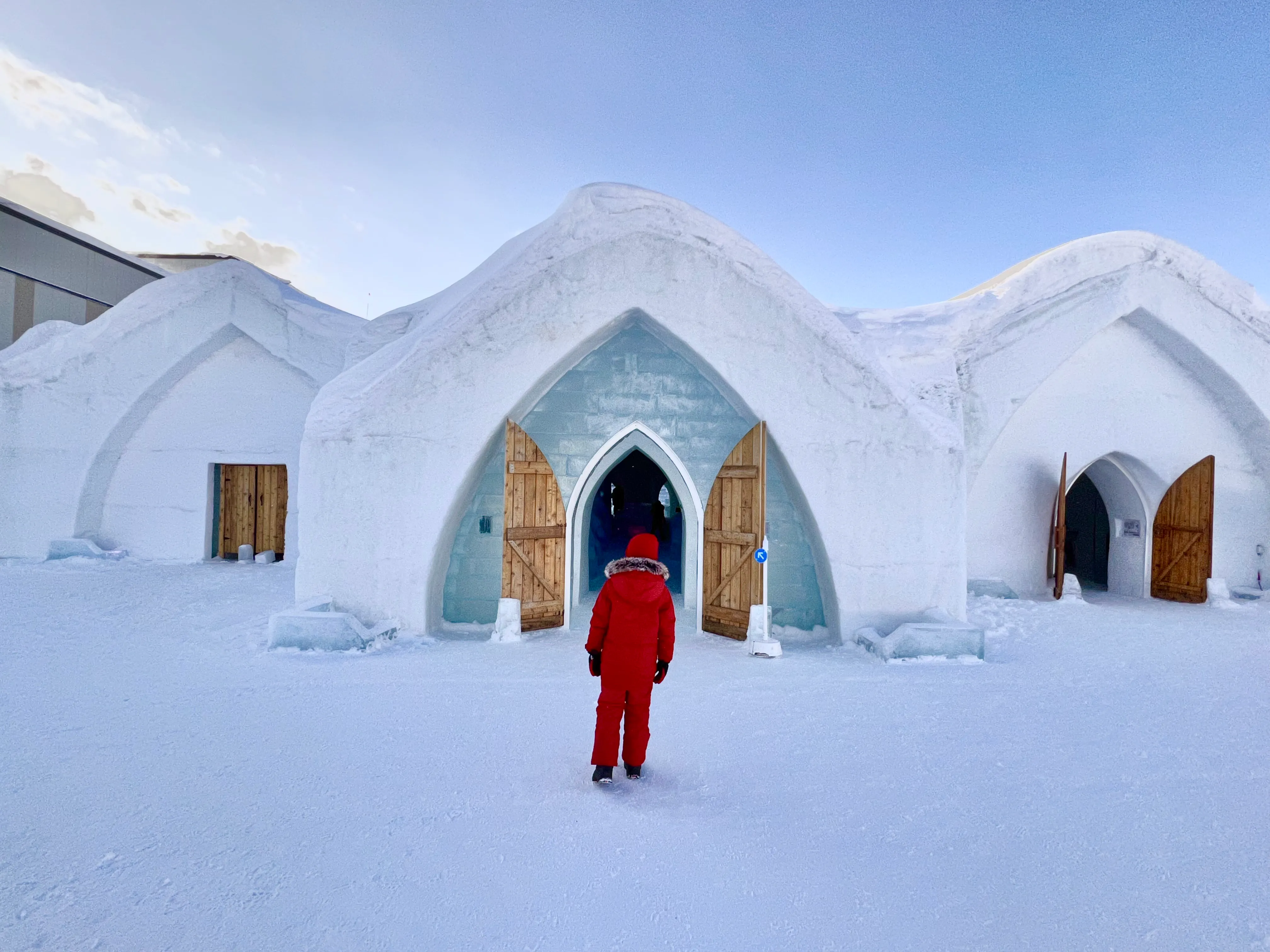 Snow-built passage with rounded ceiling and cut openings along one side